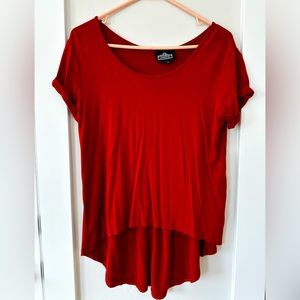 Women’s medium short sleeve, high low blouse, rust color